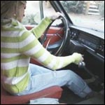 Reese Barefoot Pedal Pumping the Volvo, 1 of 3